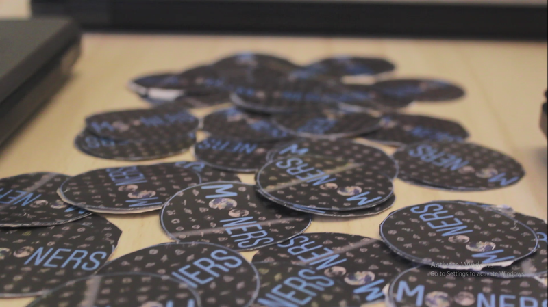 Sharing Logo stickers with the participants.