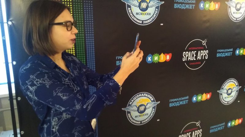 Here is Anhelina catching space debris on her phone