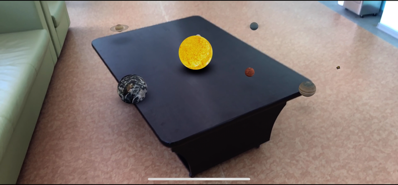 Here we can see how all the planets of the solar system stand on the table. All this works thanks to the fact that the phone recognizes the plane in this table. All this was done with the help of XCODE, ARkit and reality composer.