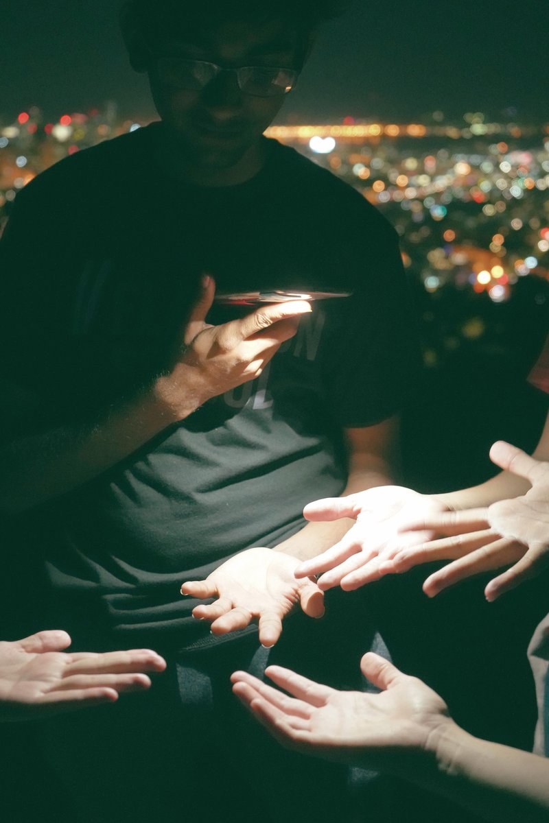 Here we are trying to see whose hand looks more futuristic for someone that will visit Pluto in the future, at 1 am ;) 
